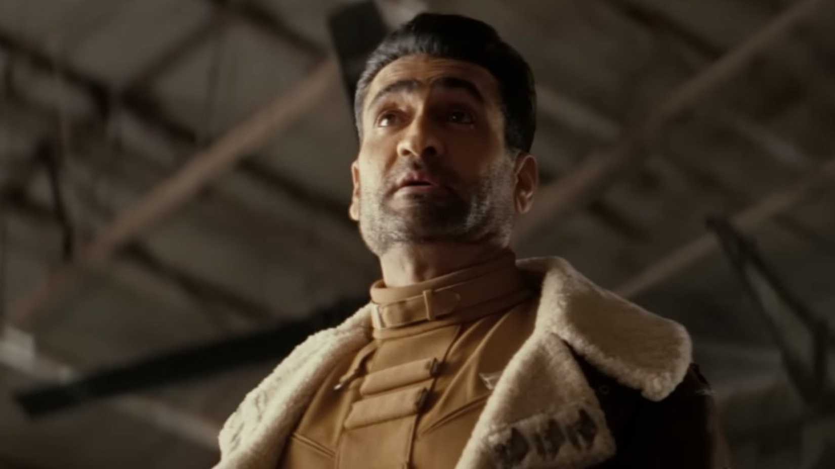 A pilot stands in a hangar in Fallout