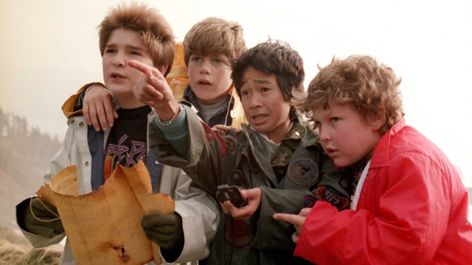four of the goonies about to embark on an adventure