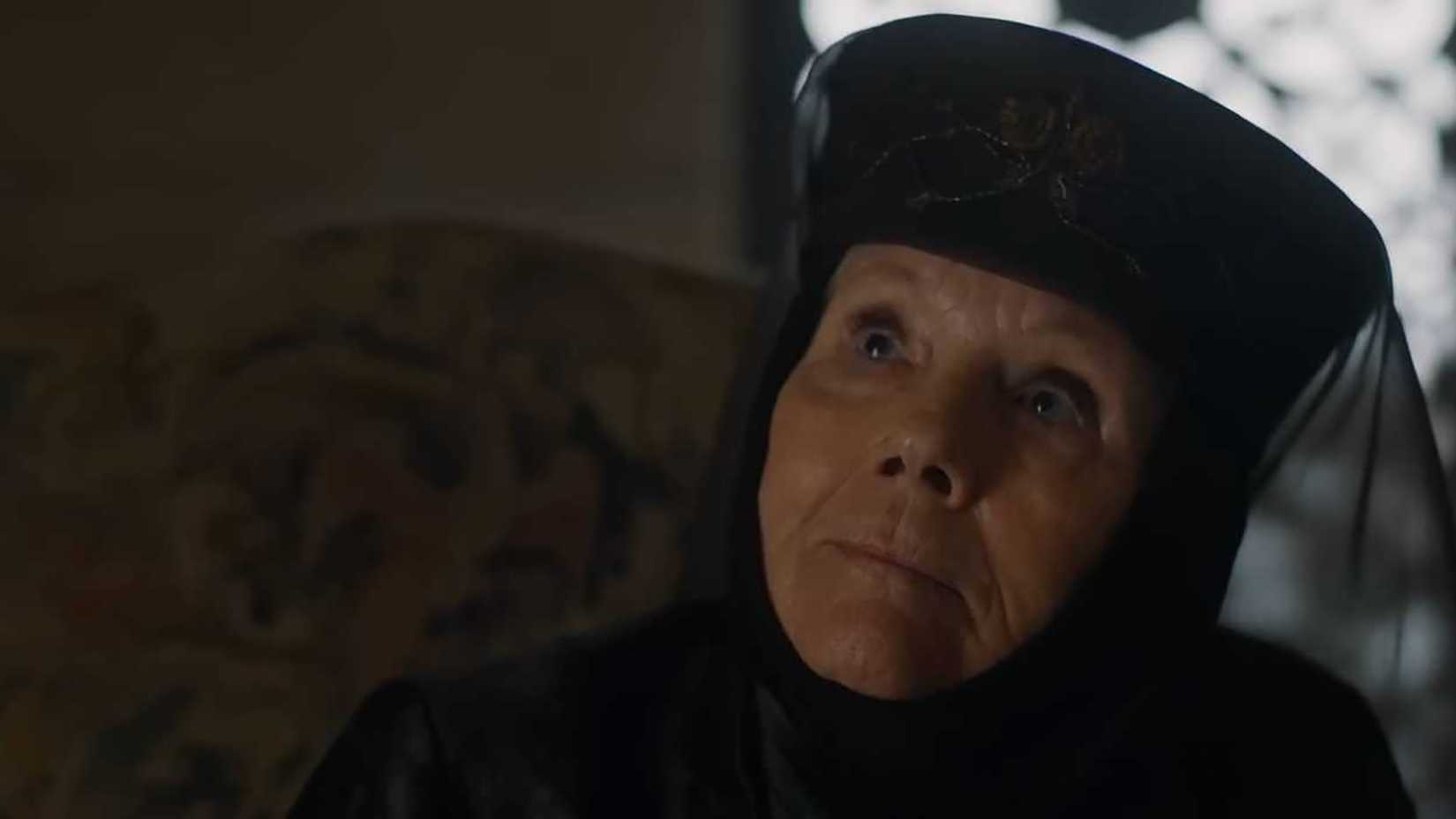 Olenna in black looking up in Game of Thrones.