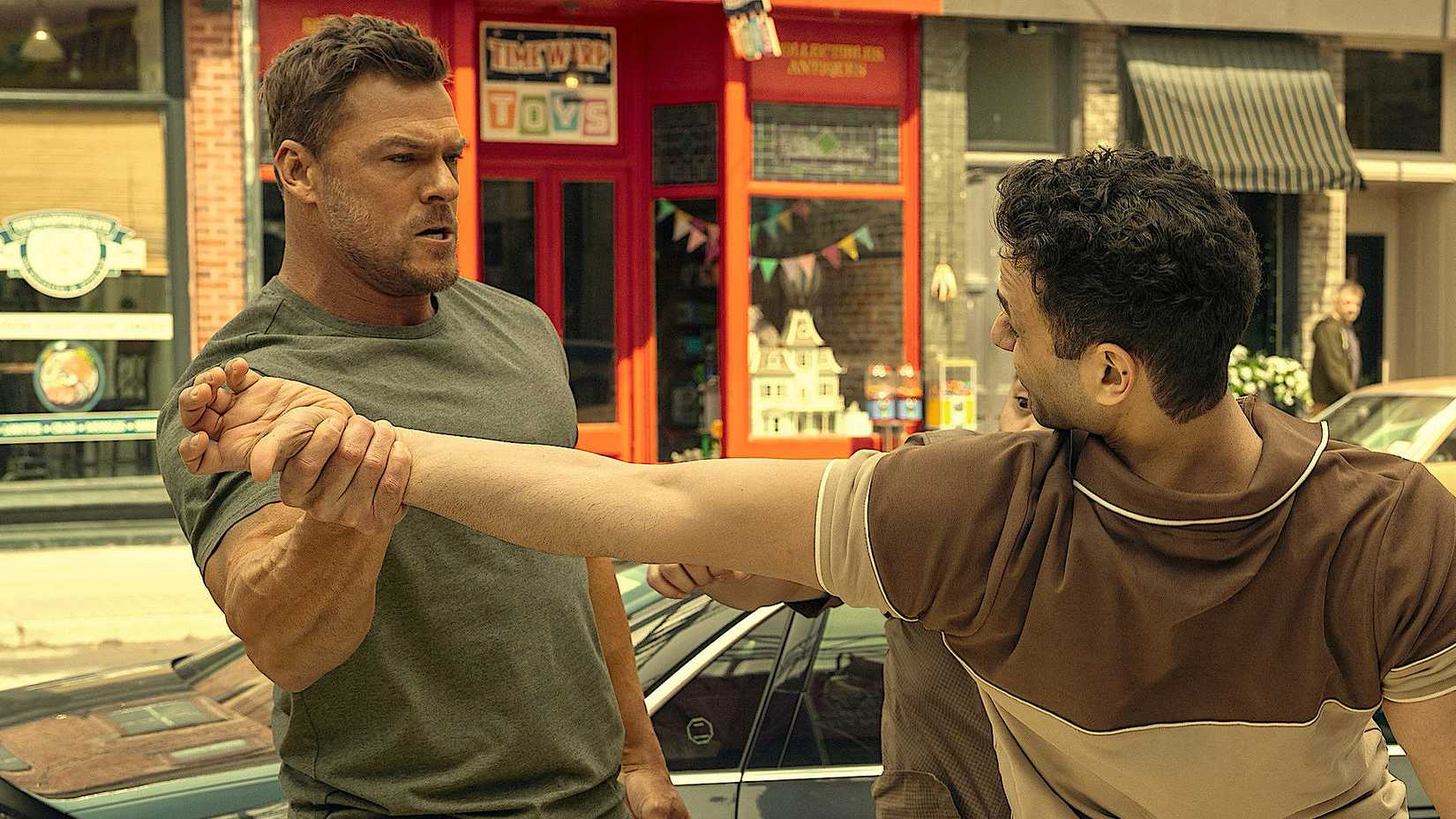Alan Ritchson Twisting Someone's Arm in Reacher