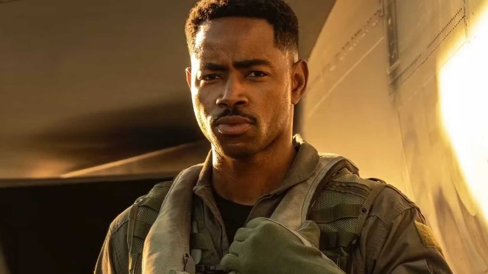 Payback poses by a jet in Top Gun: Maverick