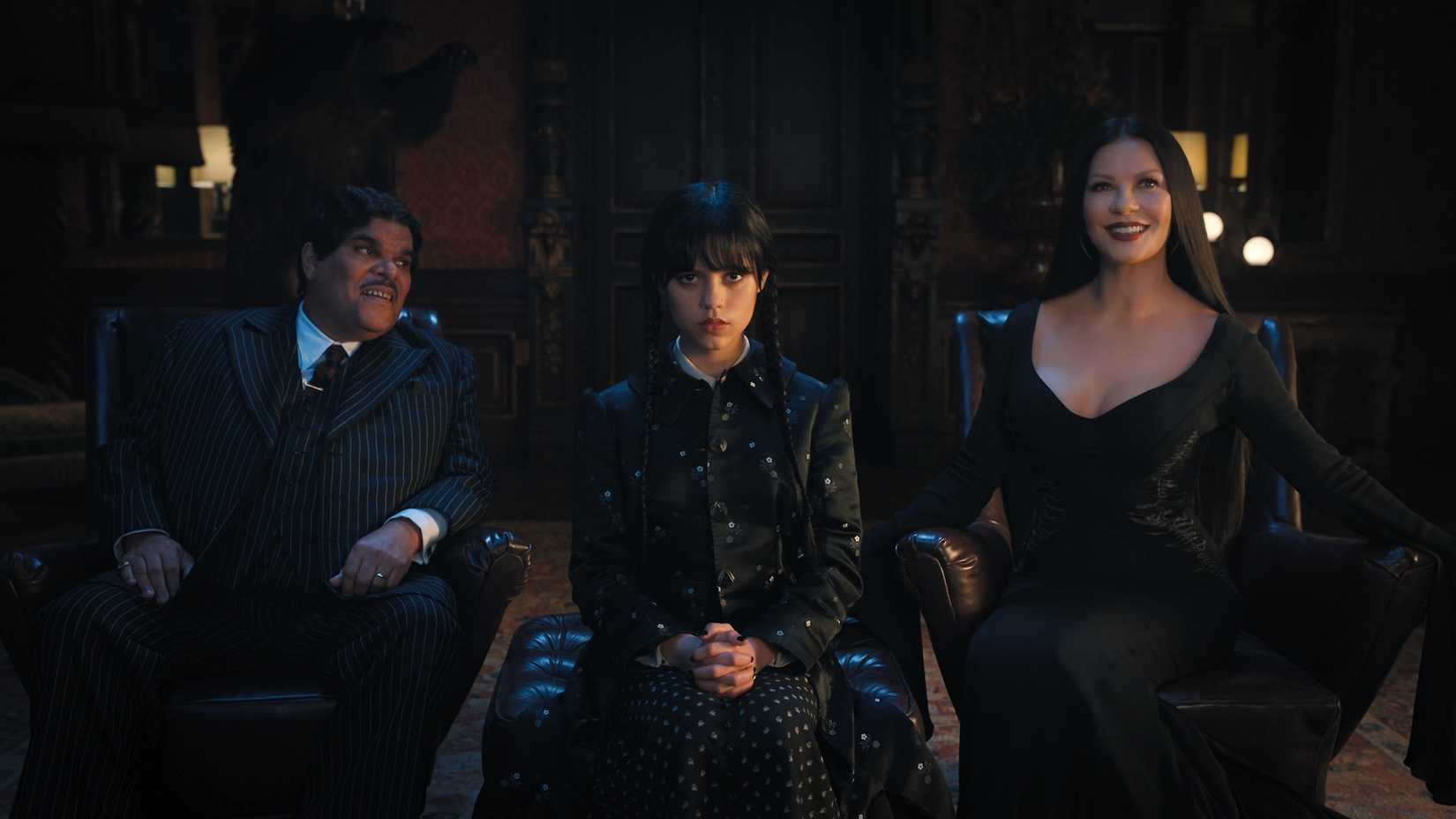 Luis Guzmán as Gomez Addams, Jenna Ortega as Wednesday Addams and Catherine Zeta-Jones as Morticia Addams in Wednesday