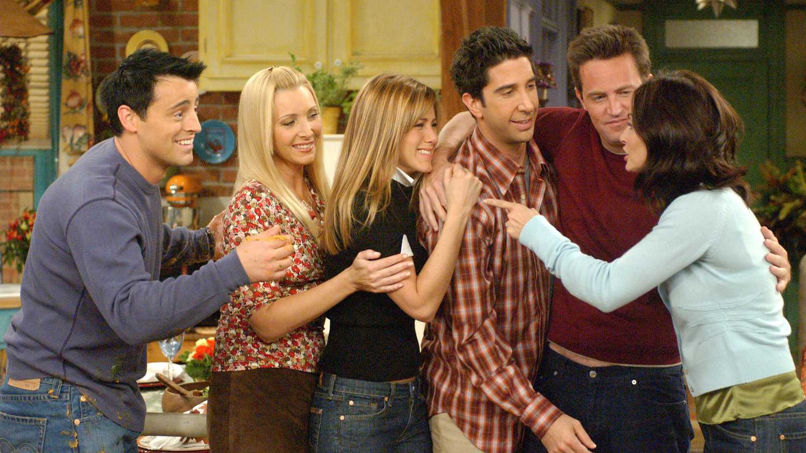 The cast of Friends hugging each other in the final scene of the finale.