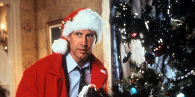 Chevy Chase as Clark by a Christmas Tree in National Lampoon's Christmas Vacation
