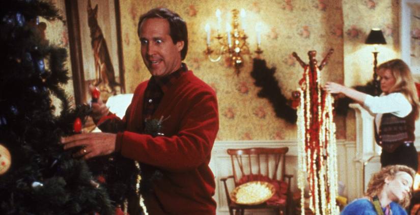 Chevy Chase as Clark by a tree in National Lampoon's Christmas Vacation