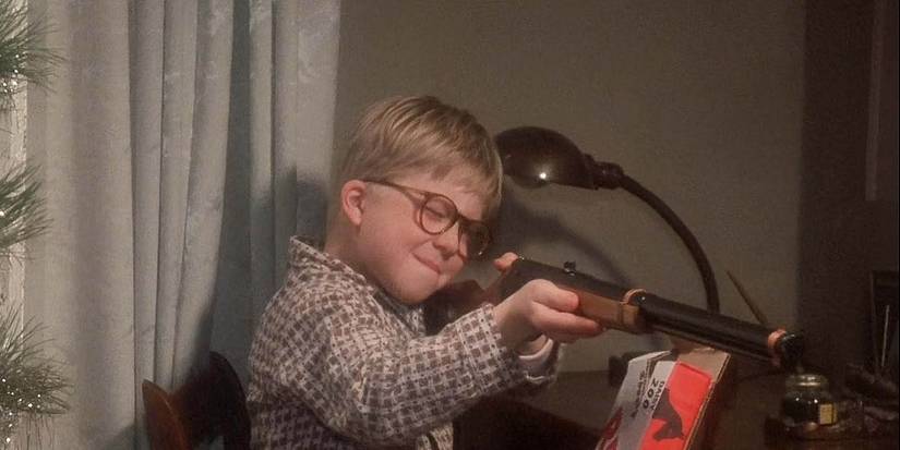 Peter Billingsley holding a gun in A Christmas Story 