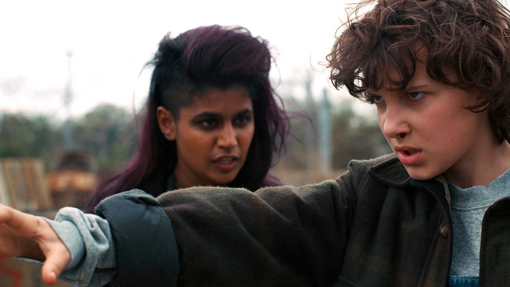 Kali coaching Eleven as she tests her powers in Stranger Things.