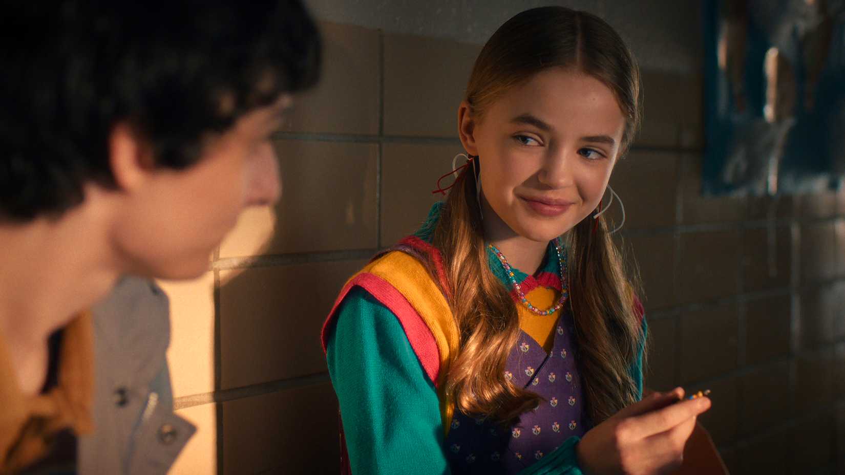 Holly smiling at Mike in Stranger Things.