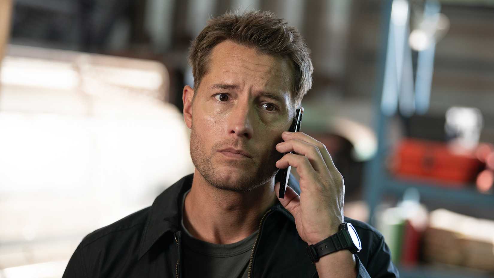 A close-up of Colter on the phone in Tracker.