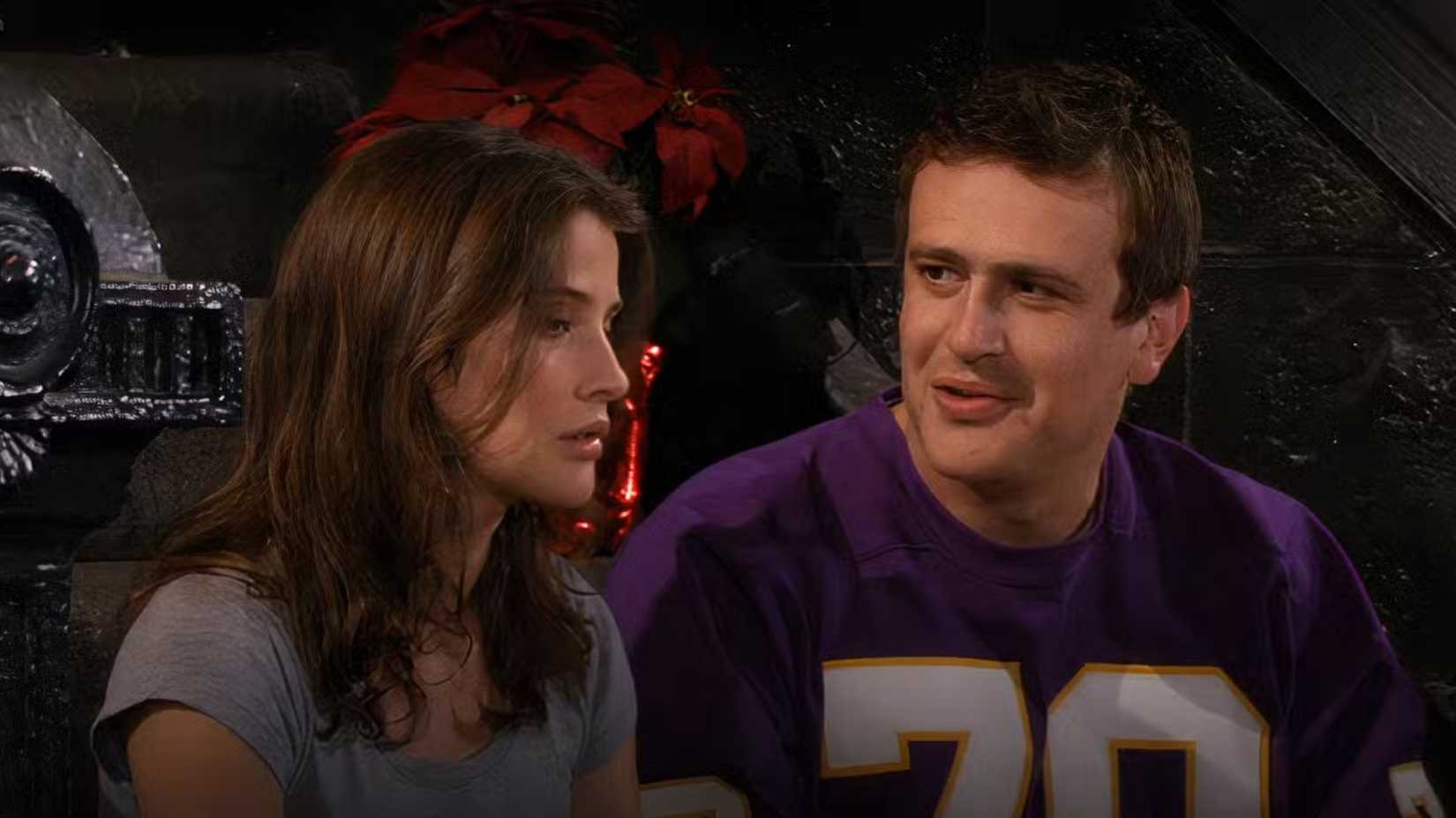 Marshall and Robin sitting on the steps outside the apartment, talking about being homesick, in How I Met Your Mother.