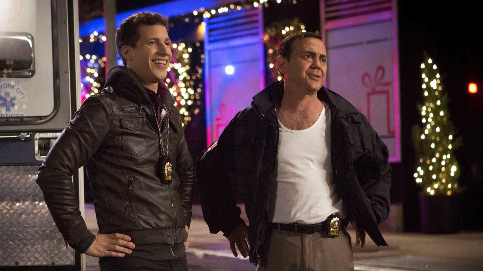 Jake and Boyle standing in the street, looking proud of themselves after saving the hostages, in Brooklyn Nine-Nine.