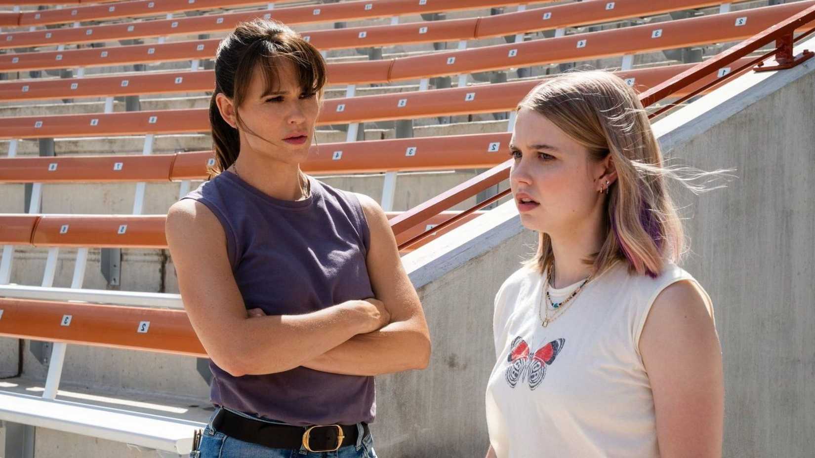 Jennifer Garner stands cross armed next to Angourie Rice in The Last Thing He Told Me