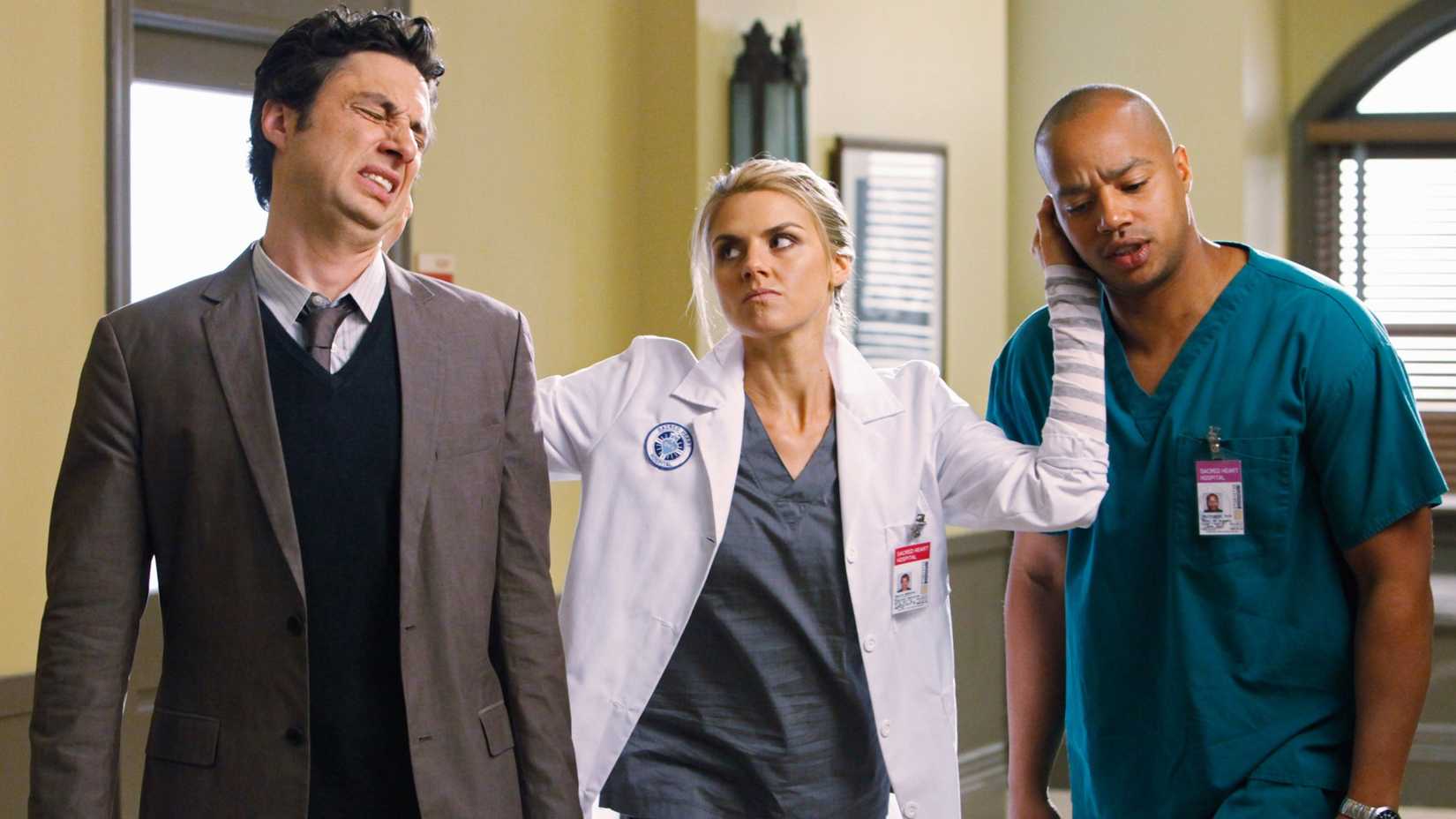 Zach Braff, Eliza Coupe, Donald Faison in Scrubs as she pulls their ears
