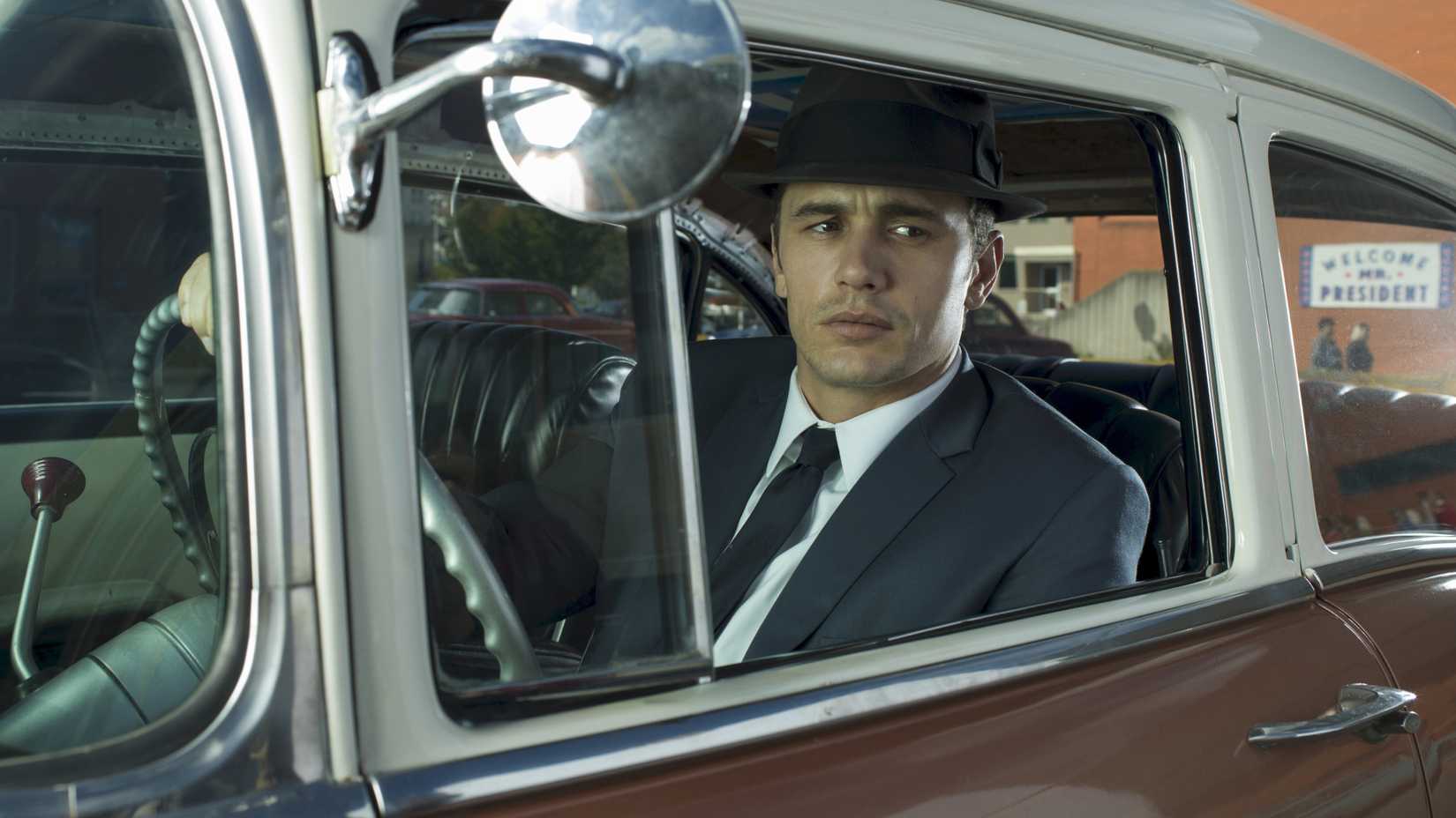 James Franco as Jake Epping sitting in a car and staring out at the street in 11.22.63.