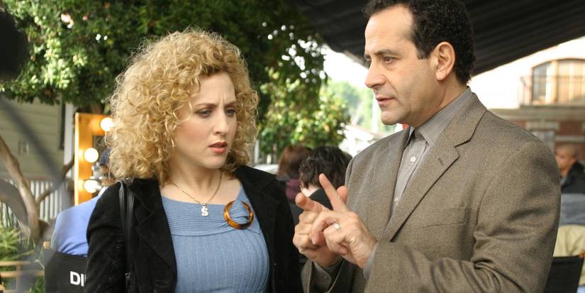 Adrian and Sharona both looking confused as they share a tense conversation in Monk. 