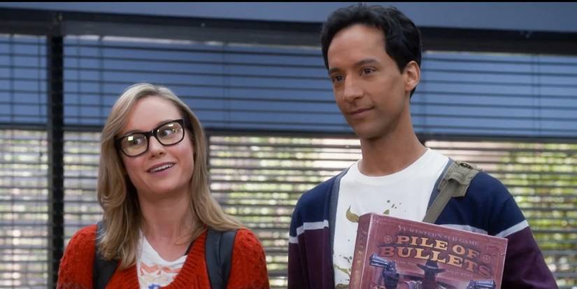 Abed and Rachel looking content as they talk to someone in the study room in Community.