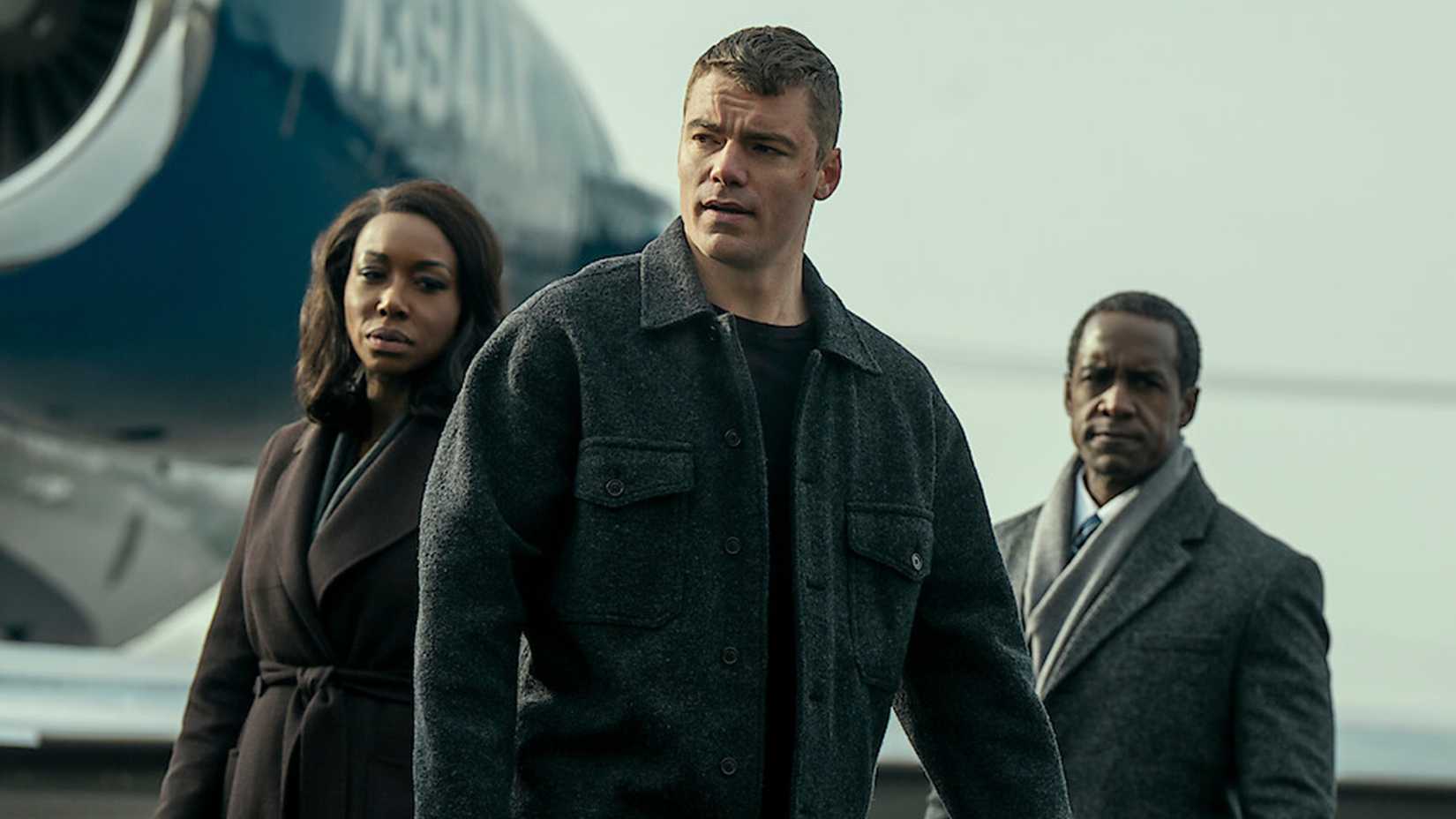 Peter, Catherine, and their boss standing together in The Night Agent.