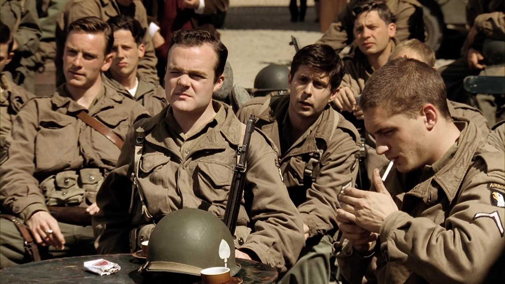 Soldiers sit together in Band of Brothers