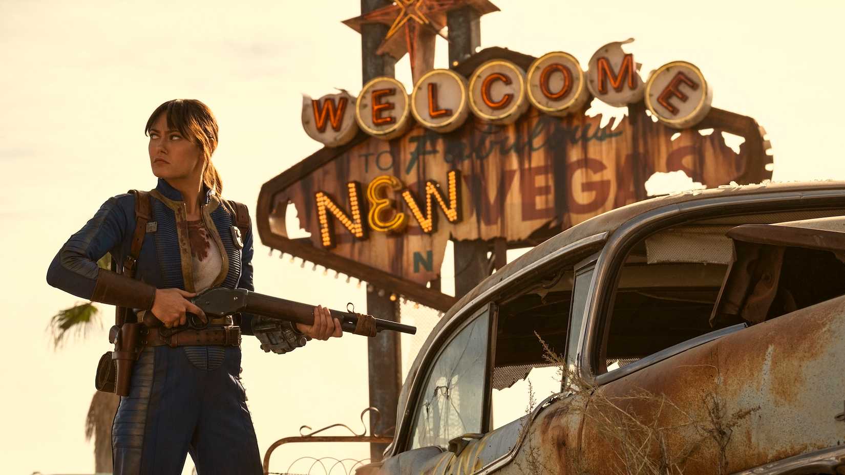 Ella Purnell's Lucy MacLean standing alongside a New Vegas sign in Fallout Season 2