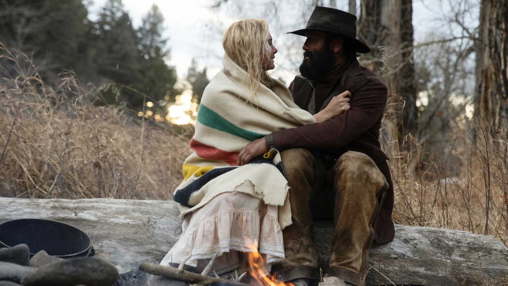 Elsa bundles by a fire in 1883