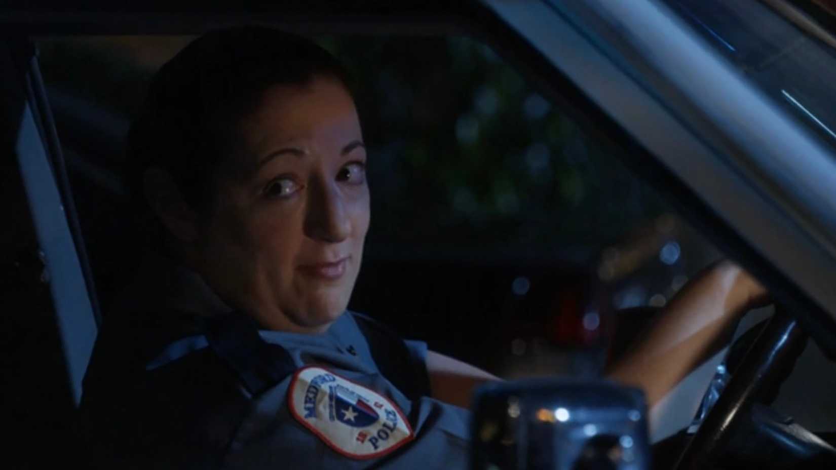 Officer Gilroy in her car in Georgie & Mandy's First Marriage.