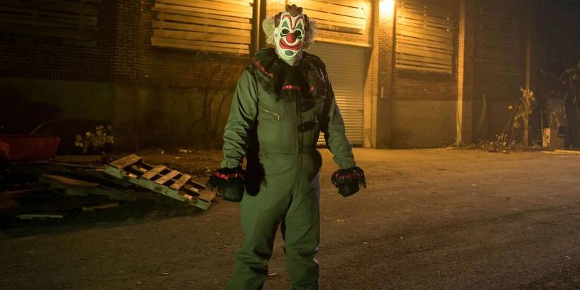 The clown villain standing outside in Haunt