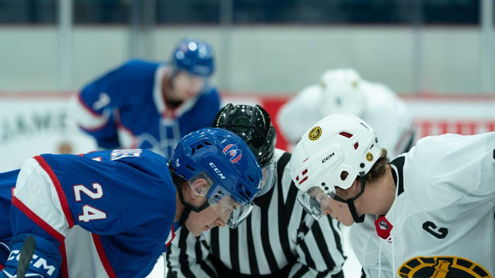 Shane and Ilya playing a hockey game in Heated Rivalry