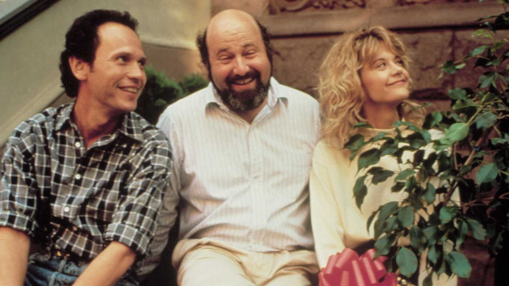 Billy Crystal, Director Rob Reiner, Meg Ryan on the set of When Harry Met Sally.