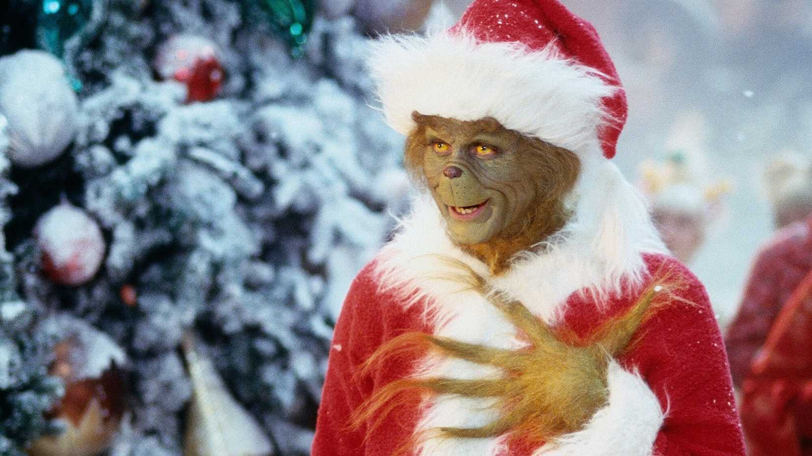 The Grinch with his paw on his chest smiling in How the Grinch Stole Christmas.