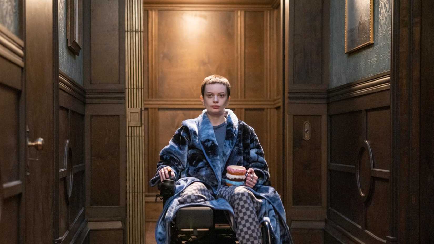 Ruth Codd as Anya sitting in a wheelchair in The Midnight Club