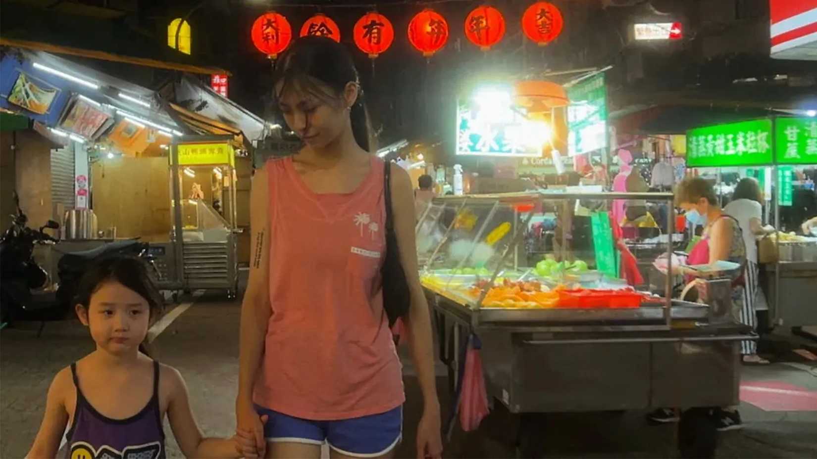 Two women walking together from Left-Handed Girl