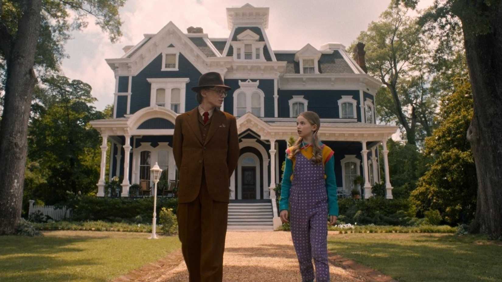 Vecna and Holly in front of the Creel house on Stranger Things.