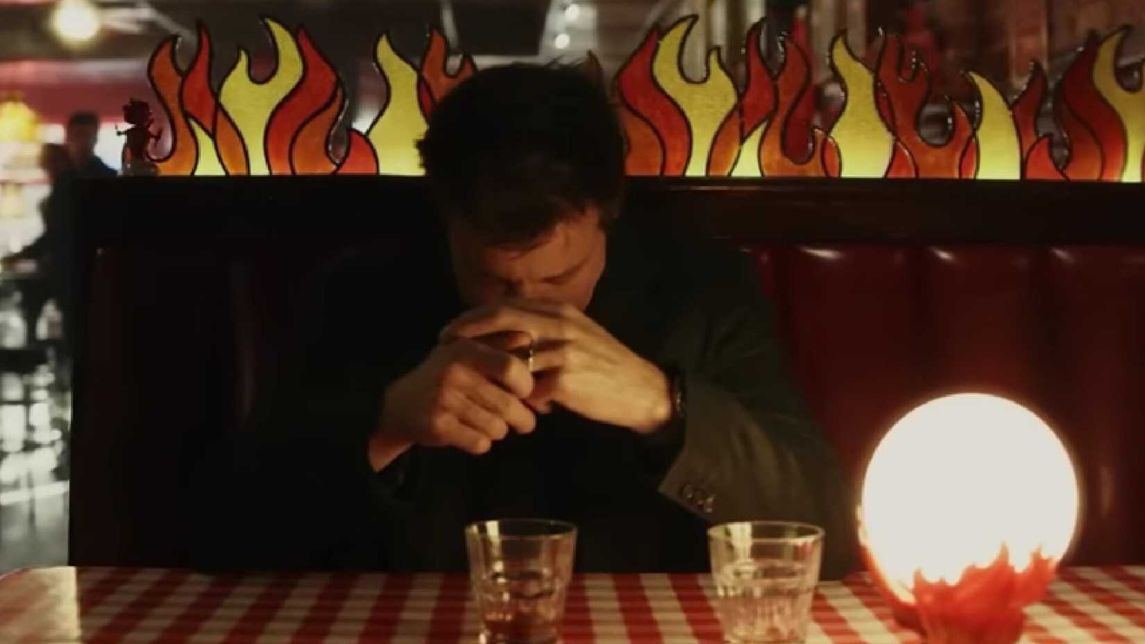 Nat hiding at the bar in Wake Up Dead Man