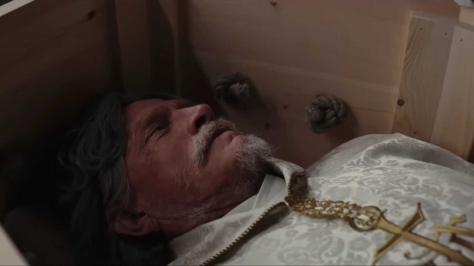 Samson in the casket before the funeral in Wake Up Dead Man