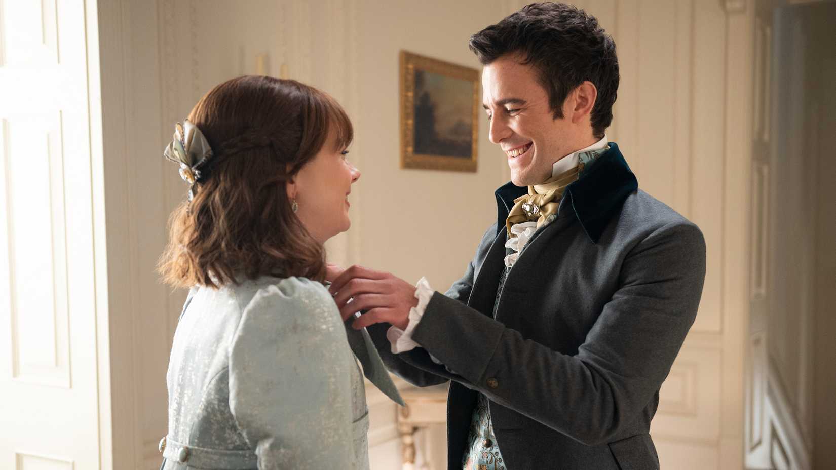 Benedict fixing Eloise's collar as she says goodbye to him before leaving for Scotland in Bridgerton.