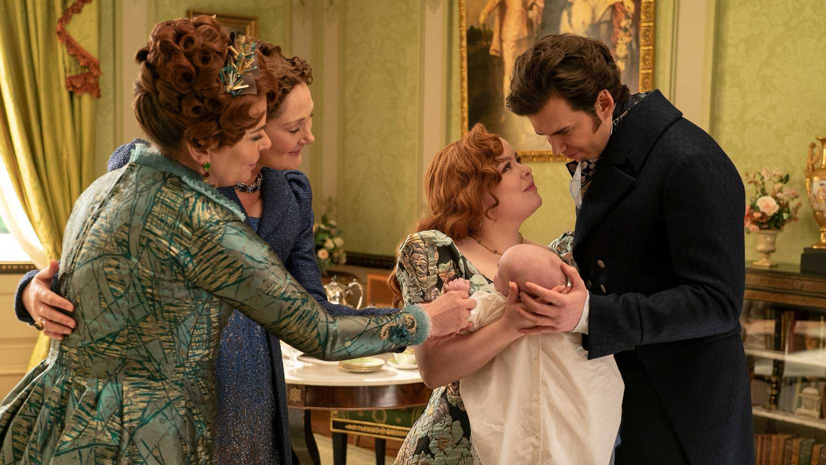 Violet and Portia cooing at Penelope and Colin holding baby Elliot in Bridgerton.