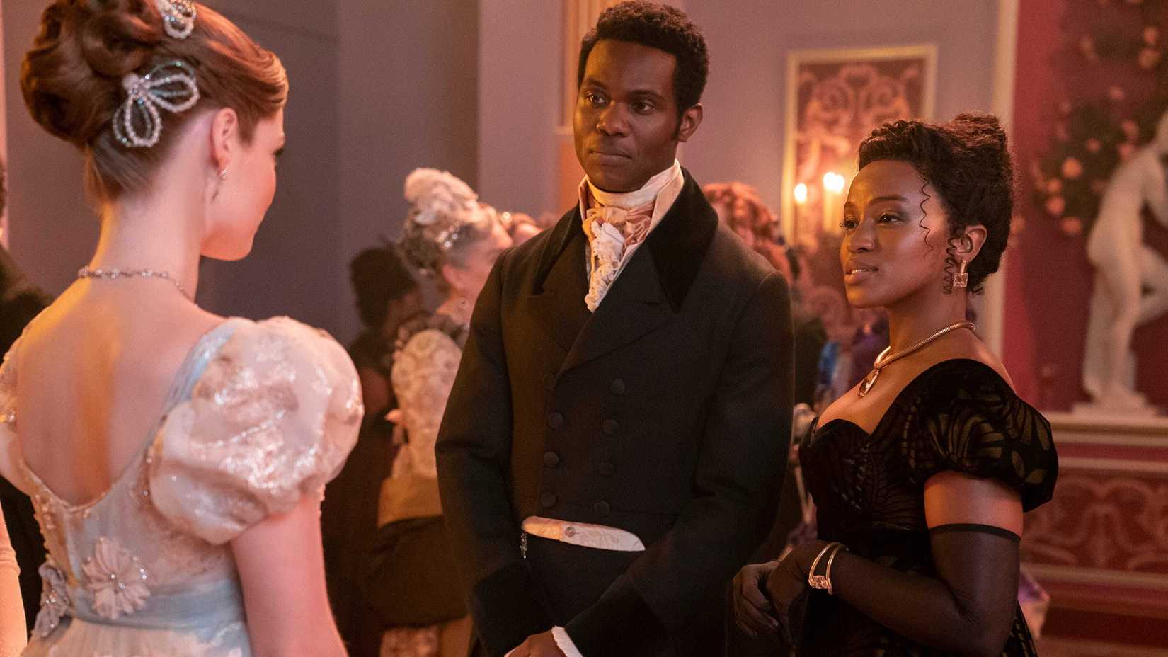 John introducing his cousin Michaela to Francesca at a ball in Bridgerton.