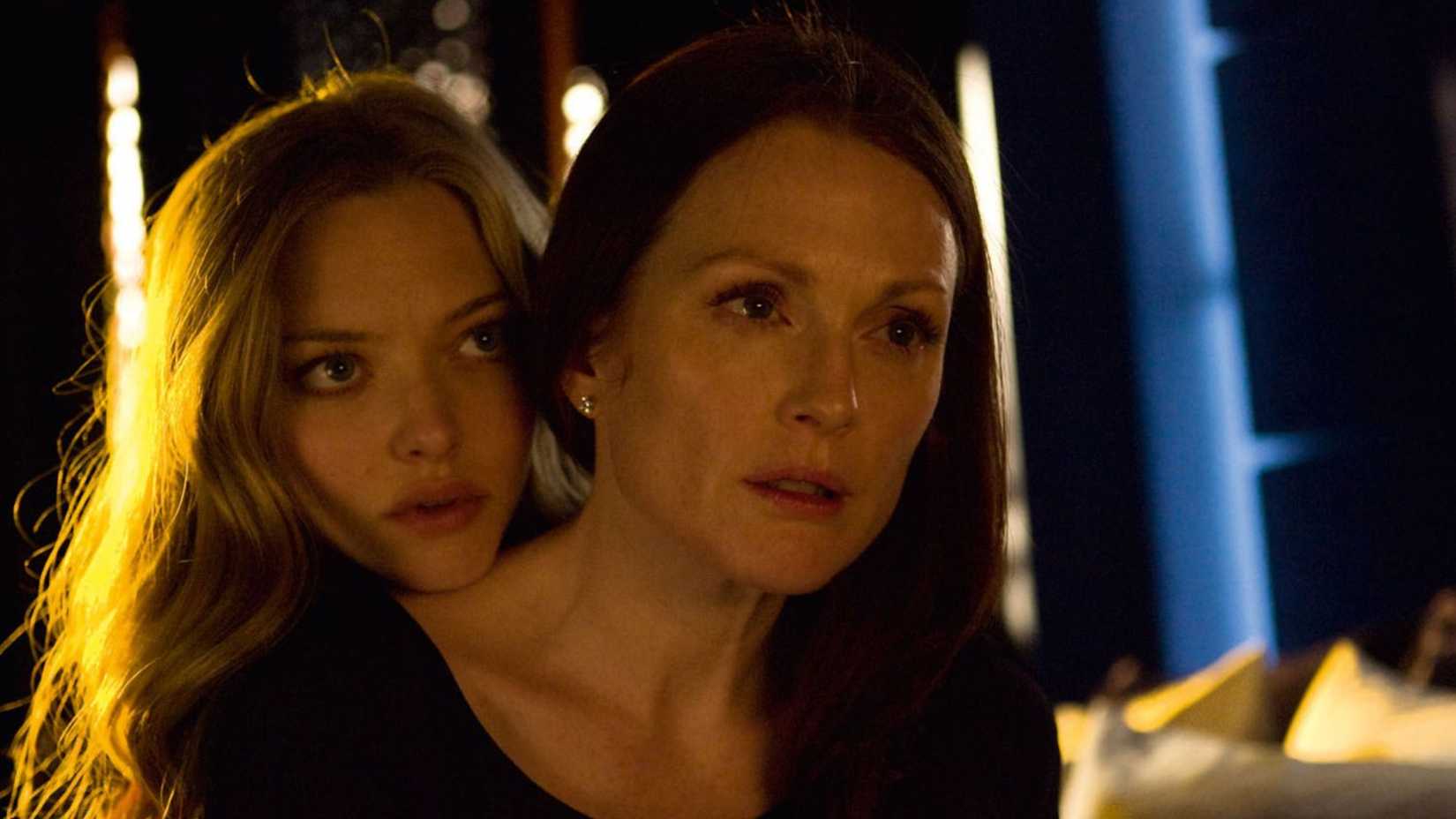 Chloe rests her head on Catherine's shoulder in Chloe