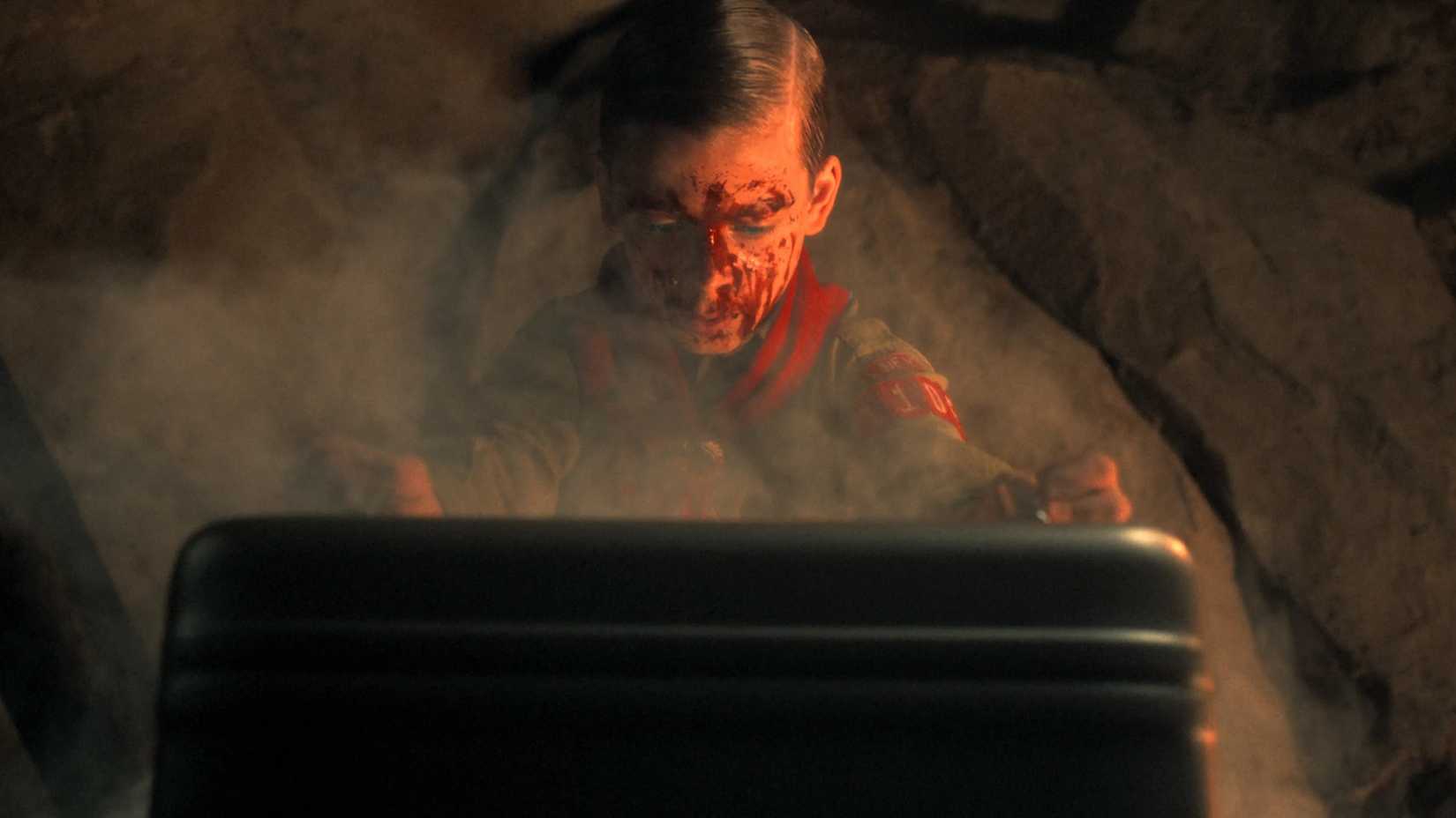 Henry opening the briefcase to find the mysterious rock in Stranger Things.