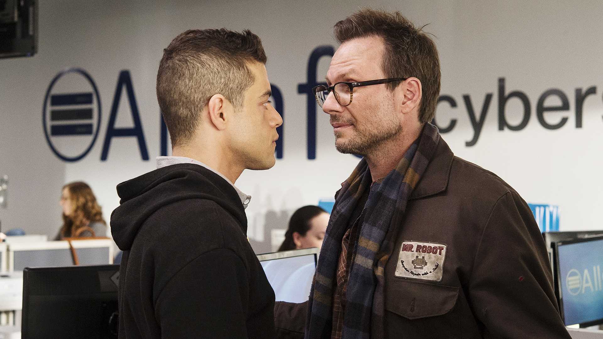 Elliot and Edward looking at each other as they have a tense conversation in Mr. Robot.
