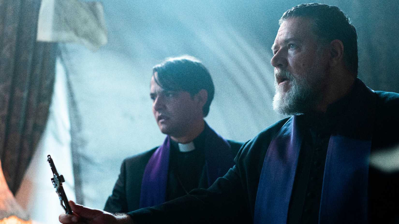 Father Amorth holds a crucifix in The Pope's Exorcist