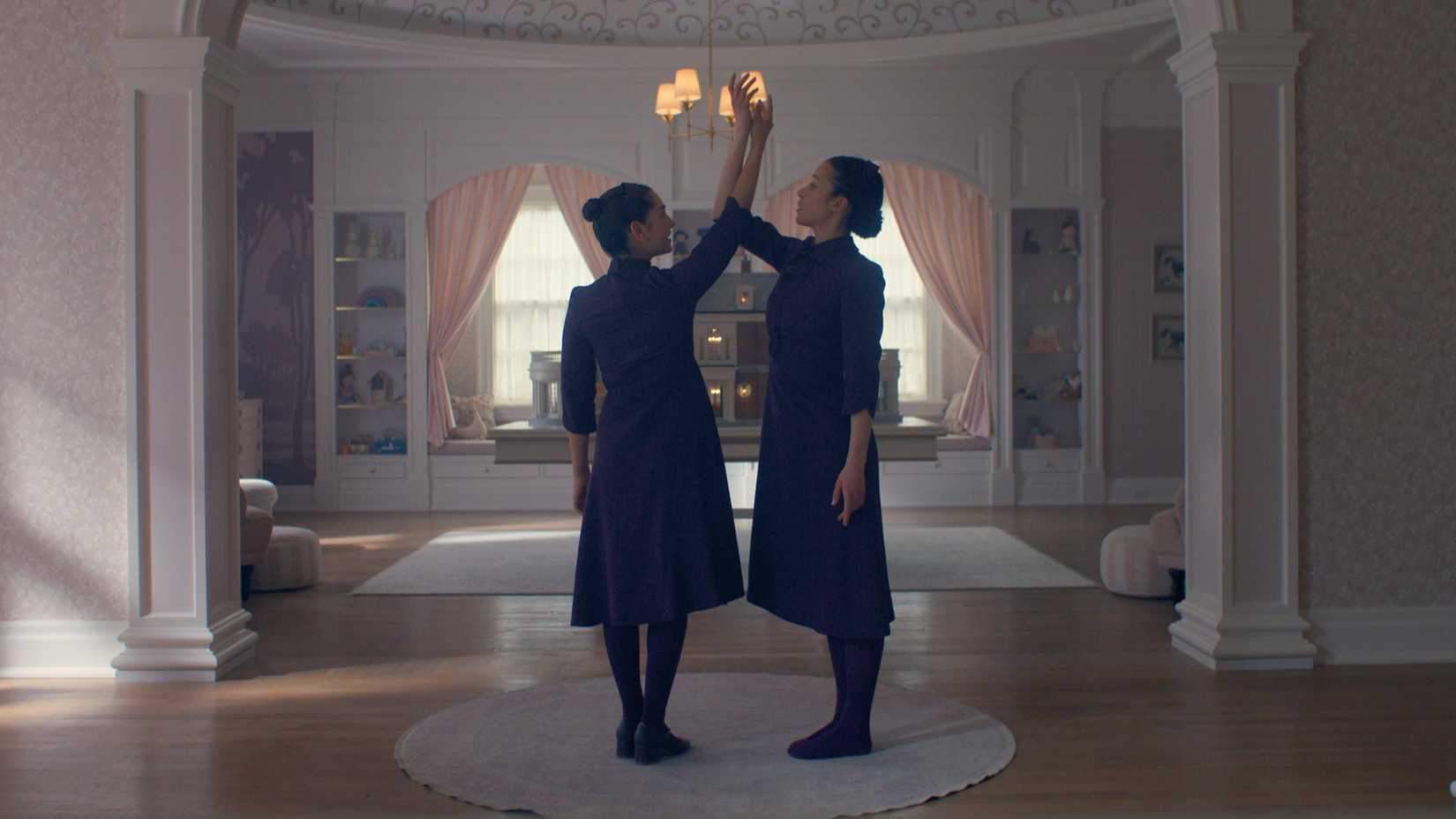 Mattea and Agnes lock arms in 'The Testaments'