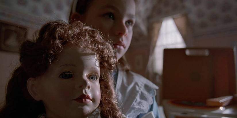 The doll and a young girl in the "Chinga" episode of The X-Files
