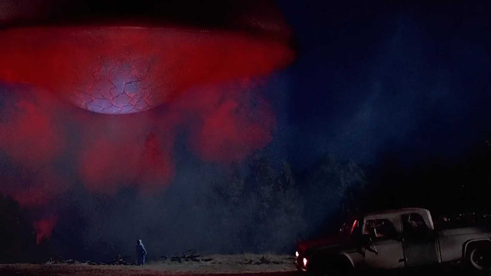 Alien ship hover over a truck in Fire in the Sky