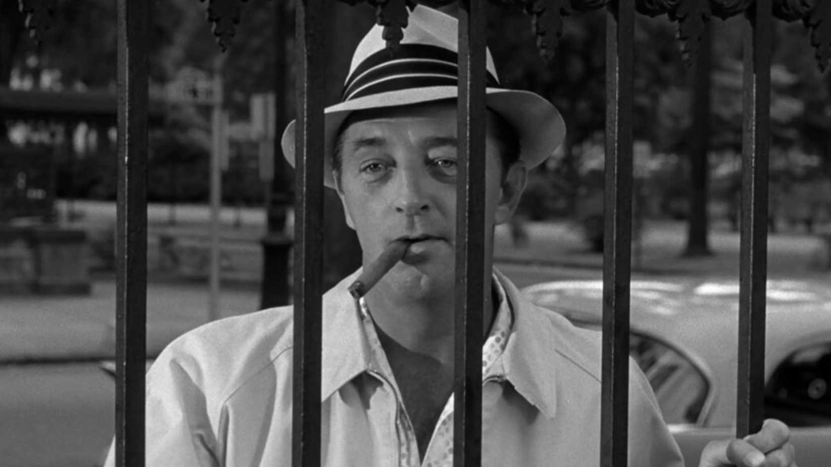 Max stands behind bars in Cape Fear