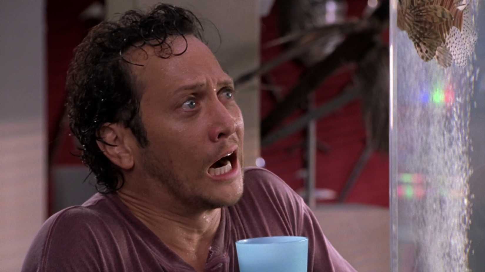 Deuce examines a fish in horror in Deuce Bigalow: Male Gigolo