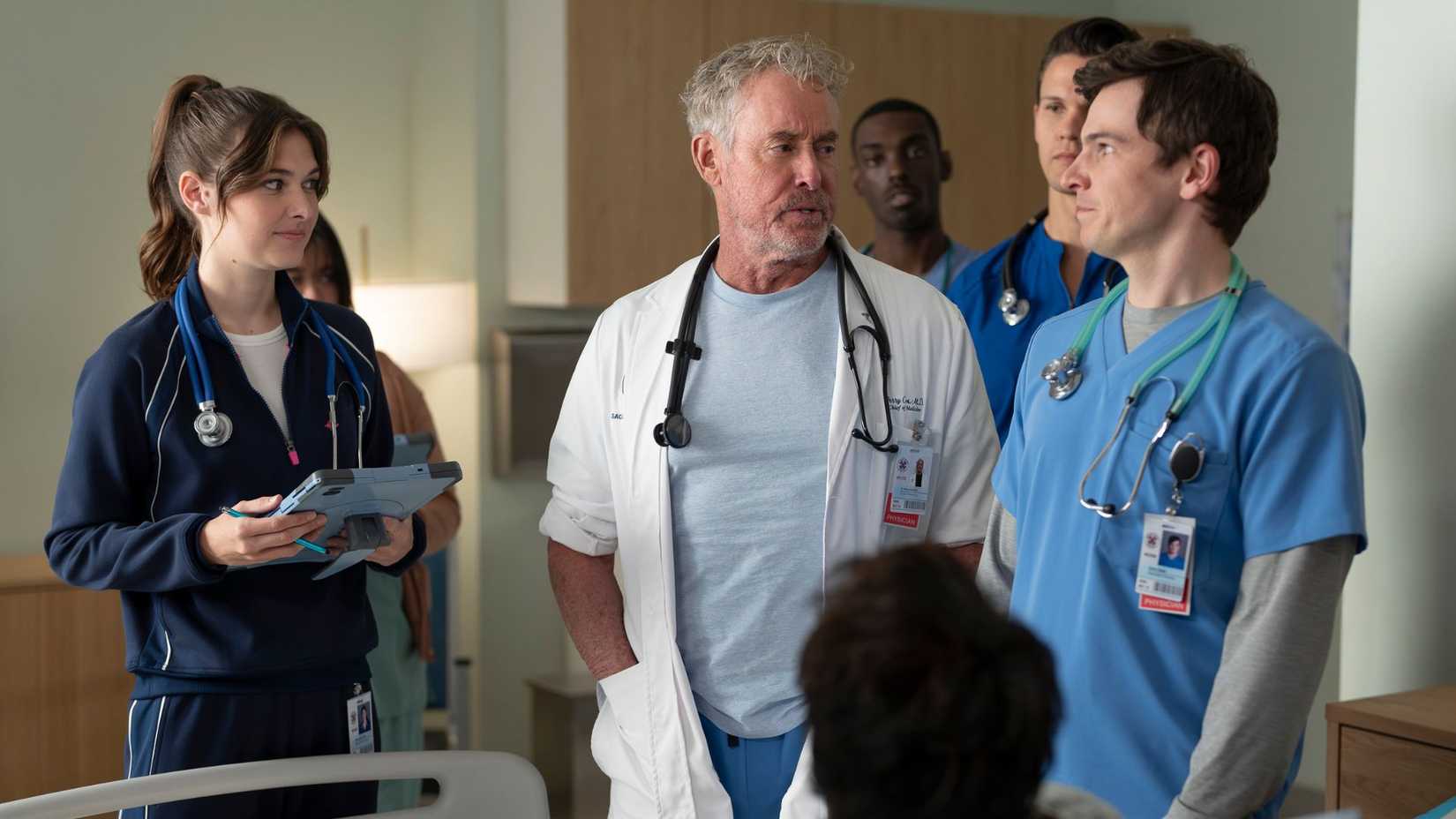 Dr. Cox teaching students in Scrubs