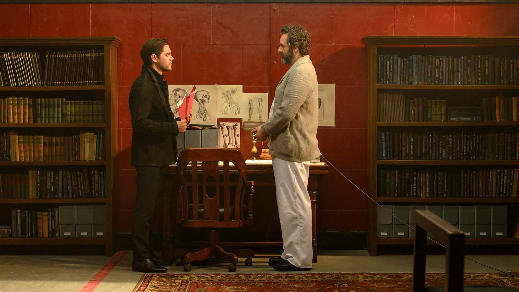 Malcolm talking to Martin who is cuffed and chained in Prodigal Son.