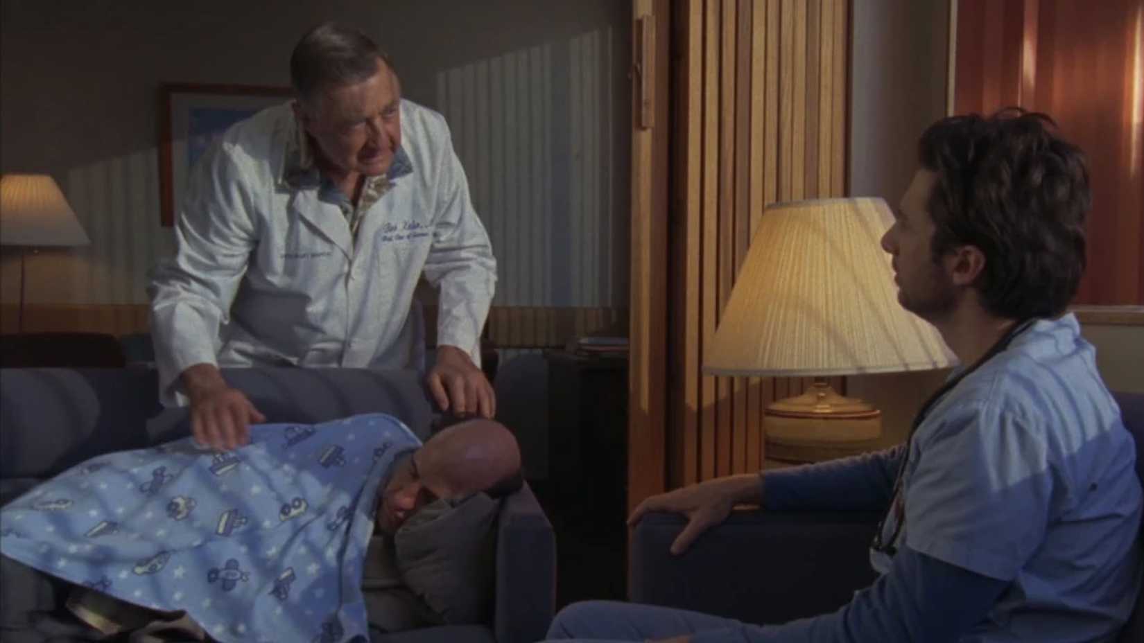 Ted sleeping on the couch in Scrubs as Kelso and JD talk