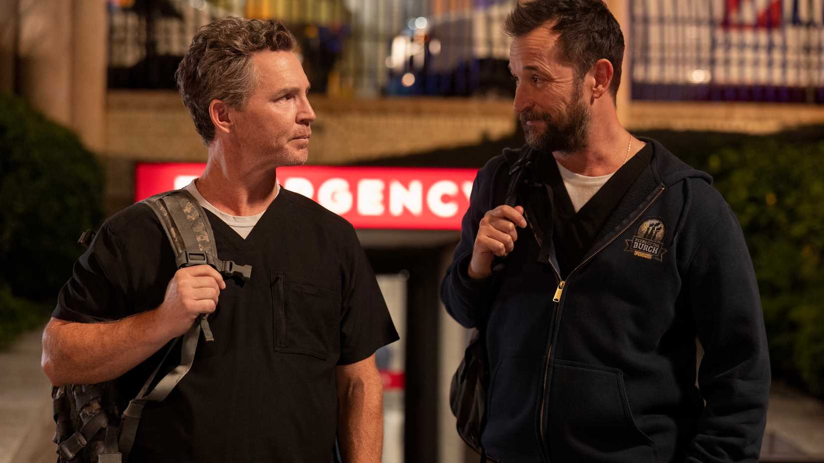 Dr. Abbott and Robby walking outside in The Pitt.